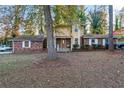 Charming home with a well-maintained front yard and mature trees at 3189 Bellgreen Way, Decatur, GA 30032
