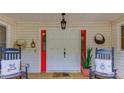 Charming front porch with rocking chairs and stylish decor at 322 Kibbee Rd, Mcdonough, GA 30252