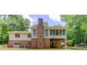Back of house featuring screened in porch and walk out basement at 322 Kibbee Rd, Mcdonough, GA 30252