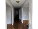 Inviting hallway featuring hardwood floors and neutral paint, creating a clean and bright passageway at 1142 Windsor Sw St, Atlanta, GA 30310