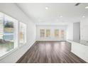 Bright living room with hardwood floors and multiple windows providing natural light at 360 White Tail Rd, Stockbridge, GA 30253