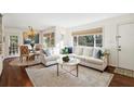 Inviting living room features a large window, modern decor, and a view into the dining area at 2506 Parkdale Ne Pl, Atlanta, GA 30305