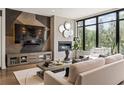 Modern living room featuring a decorative wall, fireplace, and an abundance of natural light at 904 Lenox Ne Blvd, Atlanta, GA 30324