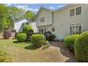 The backyard features lush greenery, mature trees, and a private deck at 1244 Newbridge Ne Trce, Atlanta, GA 30319