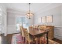 Elegant dining area with hardwood floors, wainscoting, and natural light at 1835 Berkeley Ne Mews, Atlanta, GA 30329