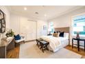Serene bedroom with neutral tones, natural light, walk-in closet, and hardwood floors at 0 Ebenezer Rd, Fayetteville, GA 30215