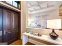 Elegant entryway with a dark wood door, stylish decor, and a view into the dining room at 0 Ebenezer Rd, Fayetteville, GA 30215