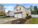 Inviting home with a two-car garage, tidy landscaping, and a well-maintained driveway at 112 Silver Fox Trl, Dallas, GA 30157
