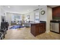 Open-concept living space with tile flooring, and stainless steel appliances at 2285 Peachtree Ne Rd # 1207, Atlanta, GA 30309