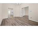 Spacious living area showcasing wood floors, leading to other rooms through elegant doorways, perfect for comfortable living at 556 James P Brawley Nw Dr, Atlanta, GA 30318