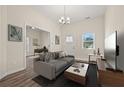 Inviting living room with high ceilings, stylish wood flooring, and modern decor, creating a cozy and elegant atmosphere at 556 James P Brawley Nw Dr, Atlanta, GA 30318
