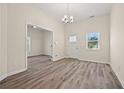 Bright living space with high ceilings, wood floors, natural light, and neutral tones, ideal for relaxing or entertaining guests at 556 James P Brawley Nw Dr, Atlanta, GA 30318