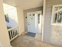 Close up of condo entrance with neutral paint and welcome mat at 35 Rumson Se Ct, Smyrna, GA 30080
