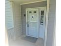 Close-up of the front entrance featuring a white door with glass and a 'Welcome' mat at 35 Rumson Se Ct, Smyrna, GA 30080