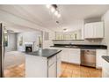 Open kitchen with stainless steel appliances, tile flooring, and connected living space at 498 Pecan Wood Cir, Fairburn, GA 30213