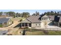 Well-maintained home with green siding, a cozy porch, and manicured lawn at 57 Cedarcrest Village Ln, Acworth, GA 30101
