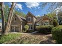 Charming home featuring a well-maintained lawn, a two-car garage, and tasteful landscaping at 2415 Carina Nw Ter, Acworth, GA 30101