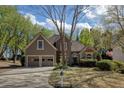 Charming home featuring a well-maintained lawn, a two-car garage, and tasteful landscaping at 2415 Carina Nw Ter, Acworth, GA 30101
