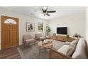 Staged living room featuring new wood-look floors, light neutral walls and bright natural light at 6175 Knights Ln, Douglasville, GA 30135