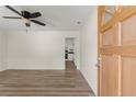 Bright, open-concept living space showcasing new wood-look floors and a ceiling fan at 6175 Knights Ln, Douglasville, GA 30135