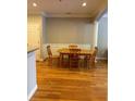 Hardwood flooring, wainscoting, and natural light complement the dining area's inviting ambiance at 1106 Stratford Commons, Decatur, GA 30033