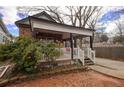 Charming home featuring a stone facade, covered front porch, and well-maintained landscaping at 1852 E Farris Ave, Atlanta, GA 30344