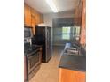Well-equipped kitchen with stainless steel appliances, ample cabinet space, and tile floors at 5331 Ridge Forest Dr, Stone Mountain, GA 30083