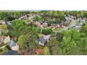 An aerial view showing the homes nestled among lush greenery and mature trees at 740 Trillium Ln, Lilburn, GA 30047