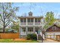 Inviting two-story home with double screened porches, and a detached garage in a leafy setting at 1643 Wade Ne Ave, Atlanta, GA 30317