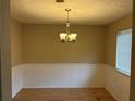 Dining area features a chandelier and views to a nearby window at 2834 Royal Path Ct, Decatur, GA 30030