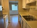 Galley kitchen with stainless steel sink and laminate countertops at 2834 Royal Path Ct, Decatur, GA 30030