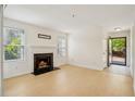 Bright living room with a fireplace and views of the exterior at 5638 River Heights Se Xing, Marietta, GA 30067