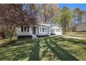 View of home with attached garage and driveway and front yard at 90 Chimney Rise Ct, Stockbridge, GA 30281