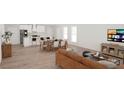 Open-concept living room flows seamlessly into the kitchen and dining area, great for entertaining at 500 West Avenue, Bowdon, GA 30108