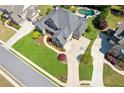 Expansive aerial view of a home featuring a pool, well-manicured lawn, and an extended driveway at 968 Woodtrace Ln, Auburn, GA 30011
