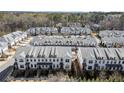 Charming townhome community with well-maintained gray roofs and manicured landscaping at 209 Phillips Ln, Alpharetta, GA 30009