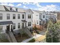 Attractive townhomes feature brick accents and inviting front stairs, blending modern style with traditional charm at 209 Phillips Ln, Alpharetta, GA 30009