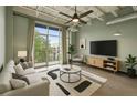 Bright, modern living room featuring floor to ceiling windows, sleek furniture, and stylish decor at 5200 Peachtree Rd # 3324, Chamblee, GA 30341