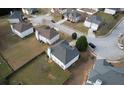 A house in a suburban neighborhood with a fenced backyard and green lawn space at 605 Oak Terrace Drive, Covington, GA 30016