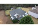 A lovely two-story home with an attached garage and big green back yard at 605 Oak Terrace Drive, Covington, GA 30016
