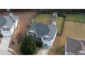 A neatly maintained two-story home with a big backyard shed and green lawn at 605 Oak Terrace Drive, Covington, GA 30016
