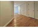 Hallway showcasing wood flooring and white trim at 195 14Th St # 1005, Atlanta, GA 30309