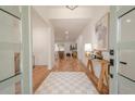 Inviting foyer with hardwood floors, stylish area rug, and modern decor leading to the living spaces at 2729 Ridge Valley Nw Rd, Atlanta, GA 30327