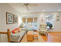 Cozy living room featuring hardwood floors, a bay window, and comfortable seating, perfect for relaxation and entertaining at 4495 Glengary Ne Dr, Atlanta, GA 30342