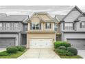 Charming two-story townhome with a well-manicured front yard and attached garage at 5669 Cobblestone Creek Pl # 12, Mableton, GA 30126
