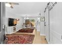 Open-concept living room with hardwood floors, natural light and dining area at 2794 Farmstead Se Rd, Smyrna, GA 30080