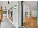 The entryway reveals hardwood floors and a view into the open living spaces of the house at 3356 Thornewood Dr, Atlanta, GA 30340