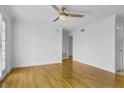 Bright living room features hardwood floors and ceiling fan at 869 Briarcliff Ne Rd # B11, Atlanta, GA 30306
