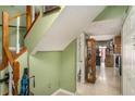 Welcoming foyer with tile flooring, staircase, and view into the living area at 105 Governors Dr, Forest Park, GA 30297