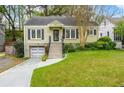 Attractive one-story home with beautiful landscaping, updated garage, and inviting front entrance at 51 Willow Wood Se Cir, Atlanta, GA 30317